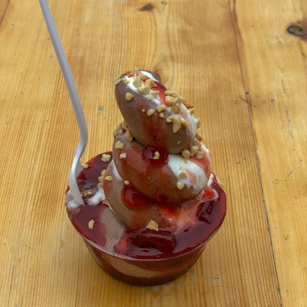 Family enjoying ice cream on the covered wooden deck
