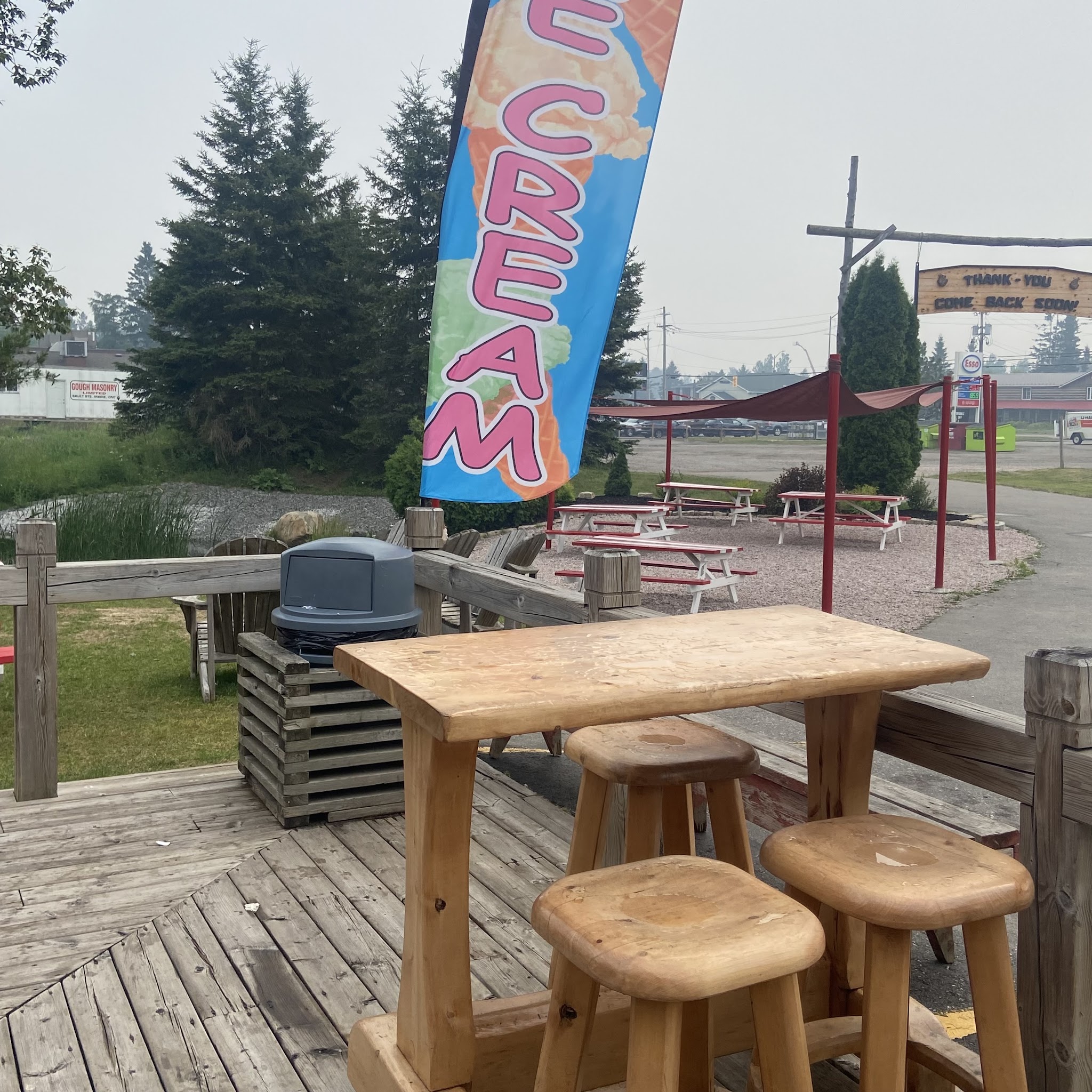The carved wooden Big Moose sign and log-cabin exterior of the Big Moose Ice Cream Parlour storefront